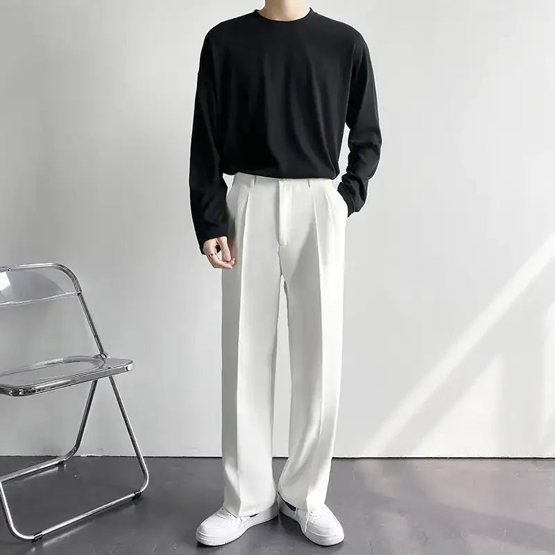 White pleated trousers with a clean, minimalist design.
