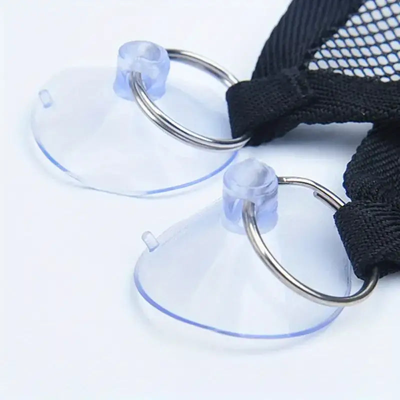 Clear plastic suction cups with metal rings and black mesh straps.