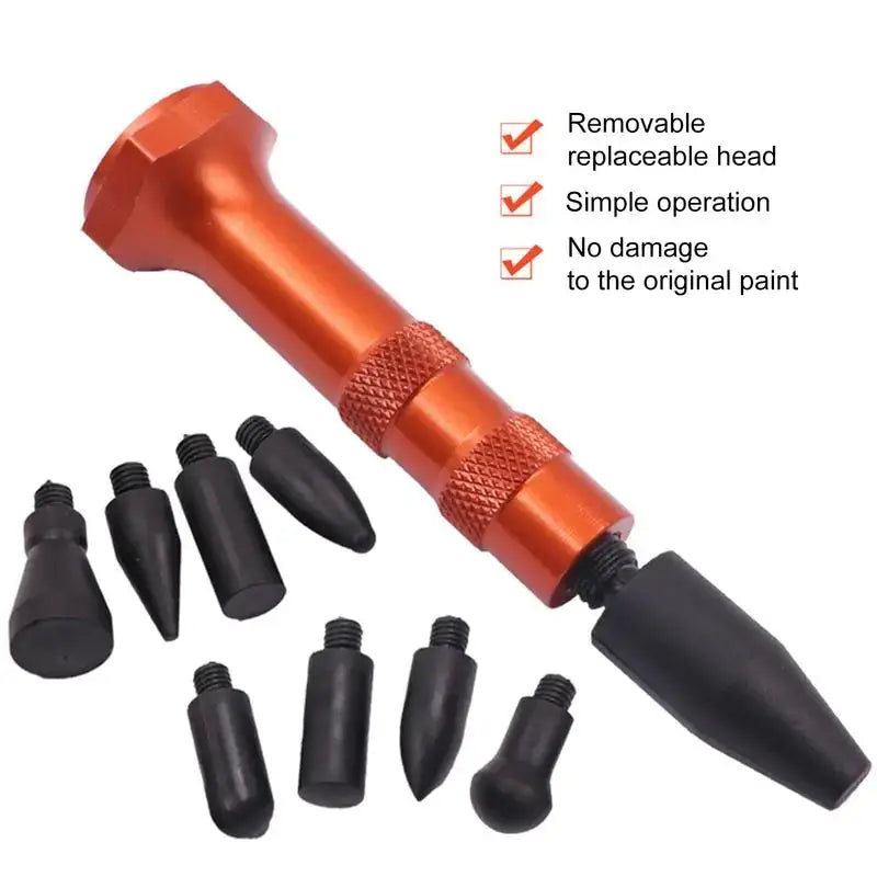Orange metallic car dent removal tool with black replaceable tips.