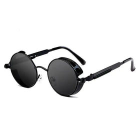 Black round-framed steampunk-style sunglasses with dark gray lenses and metallic accents.
