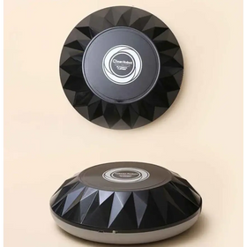 Black geometrically faceted cleanrobot automatic vacuum cleaner with a silver base and central logo.