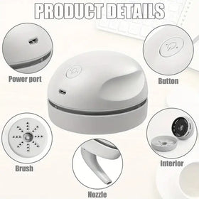 White compact desktop vacuum cleaner with a sleek, rounded design and removable brush attachment.