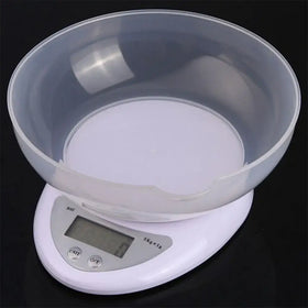 White digital kitchen scale with transparent bowl on top