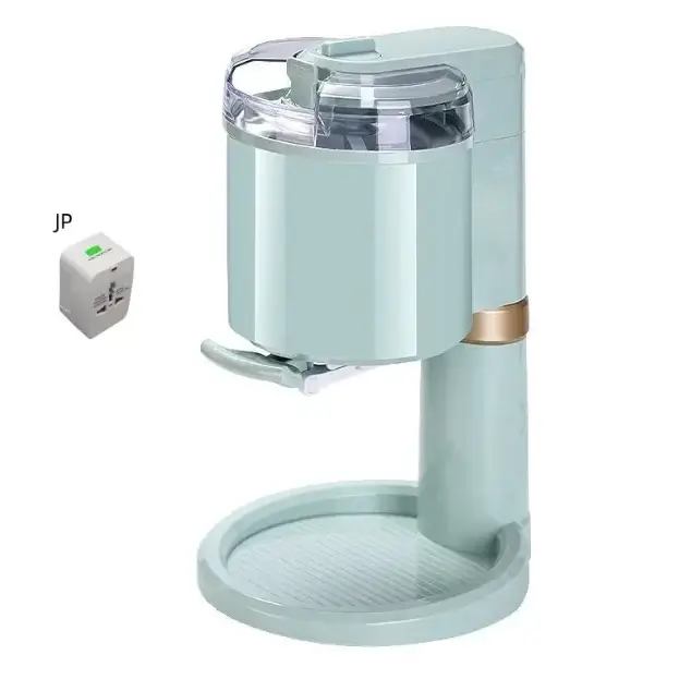 Pastel mint-colored ice cream maker with a clear lid and gold-accented base.