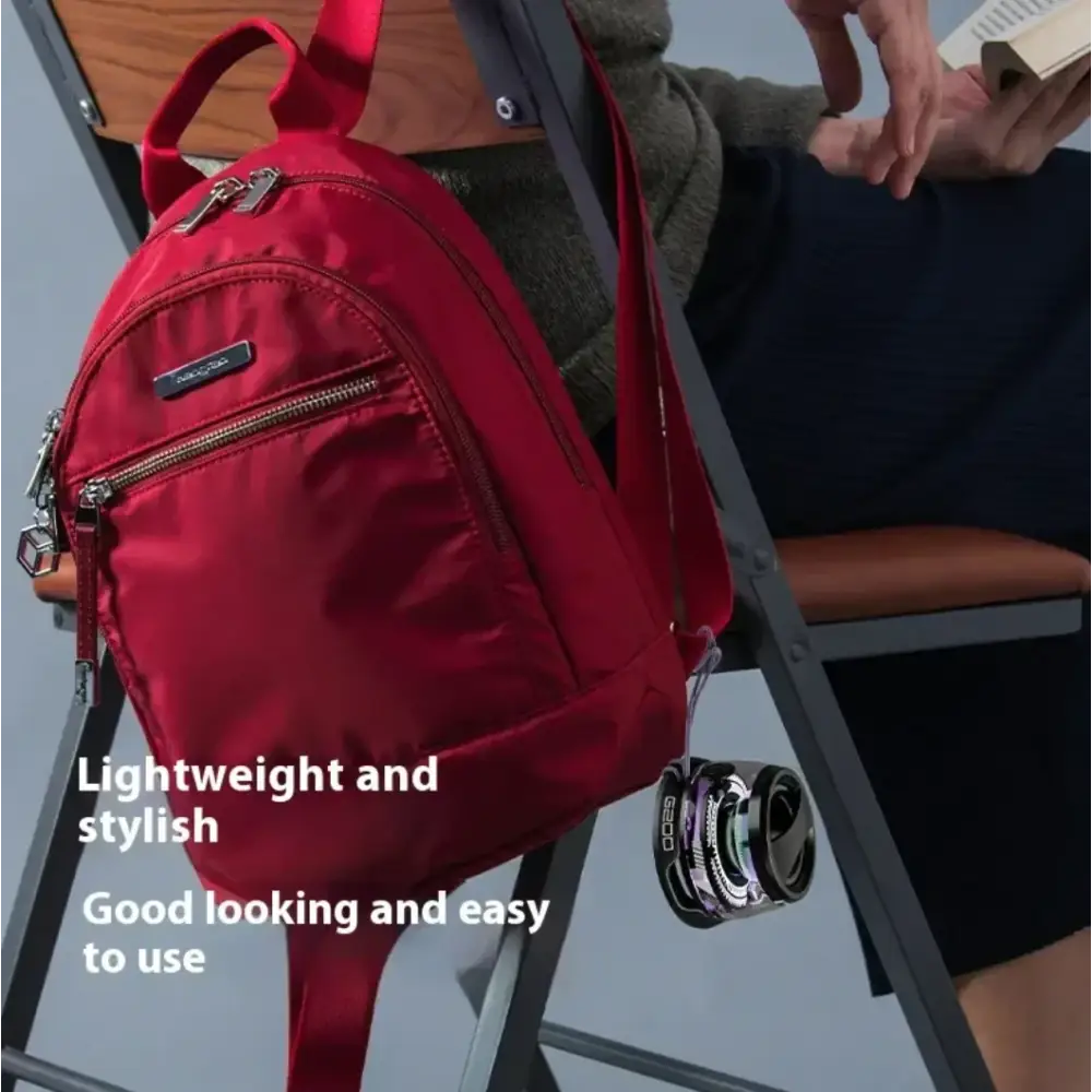 A vibrant red, lightweight nylon backpack with silver zippers and a small brand tag.