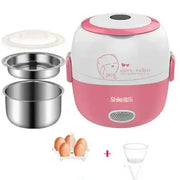Pink and white electric rice cooker with stainless steel inner bowls, featuring a cute cartoon face design on the lid.