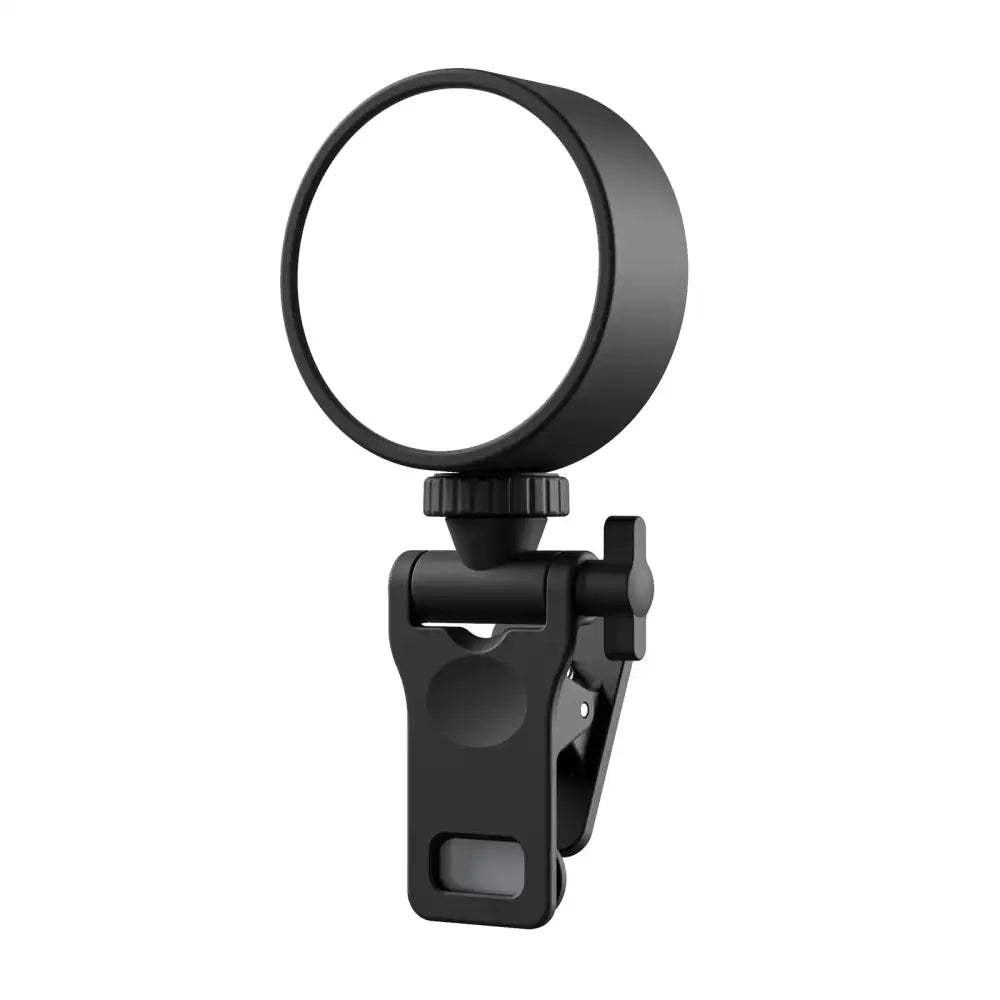 Black circular clip-on ring light with adjustable clamp and textured grip.