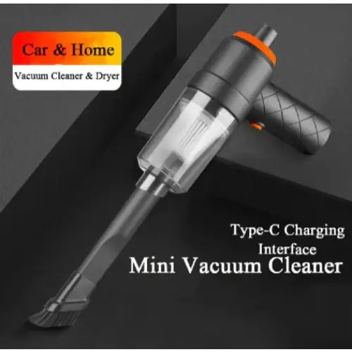 Gray and orange handheld mini vacuum cleaner with a transparent dust collection chamber.