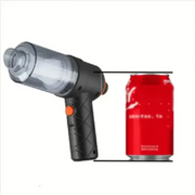 Black and transparent handheld vacuum cleaner with an orange trigger, designed for cleaning small spaces.