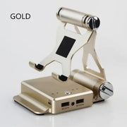 Gold-colored tablet stand with integrated charging ports and a sleek, minimalist design.