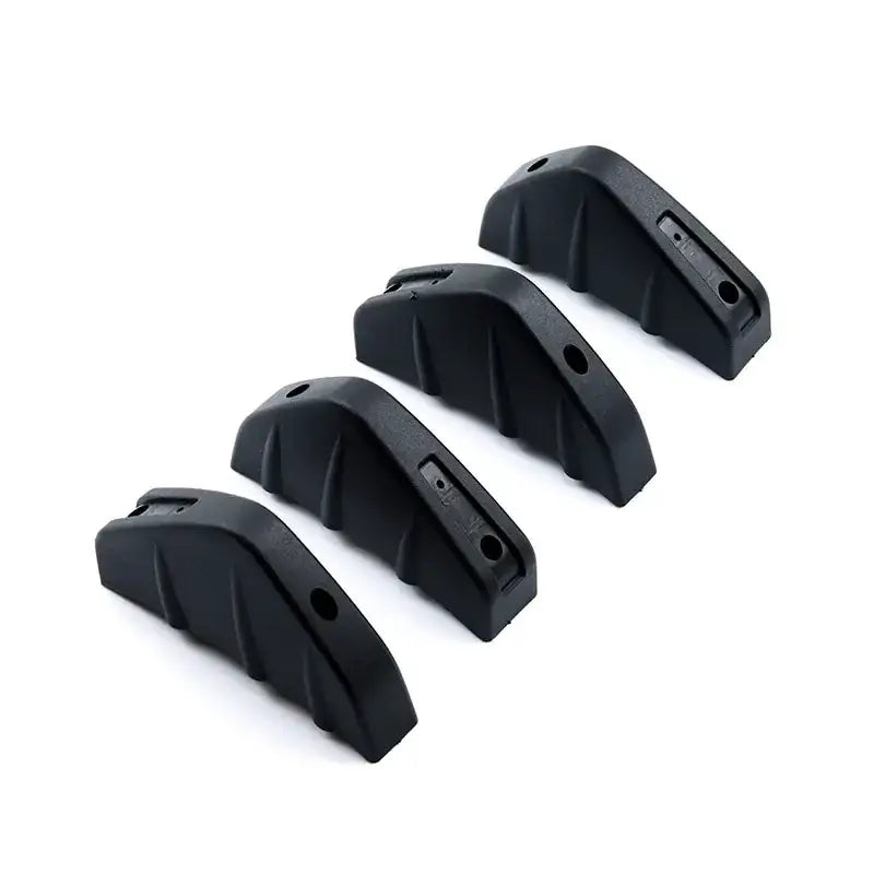 Black plastic car bumper guard covers with textured, ribbed surfaces and pre-drilled mounting holes.