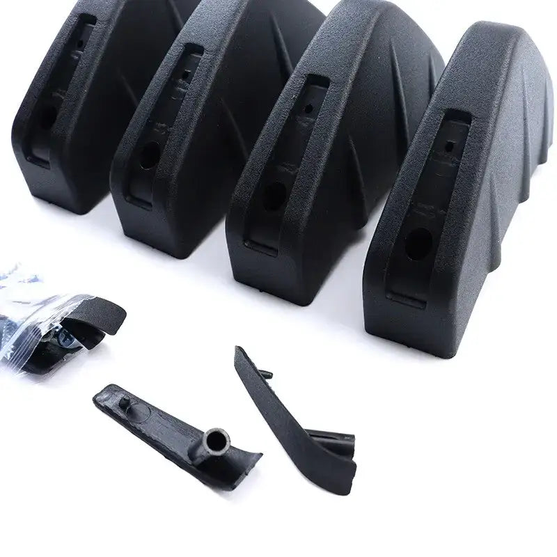 Black plastic car door handle covers with a textured, angular design.