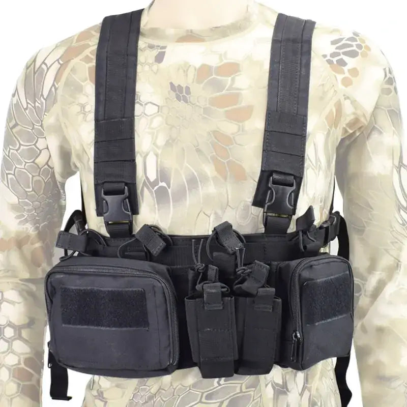 Black tactical chest rig with multiple pouches and adjustable straps.