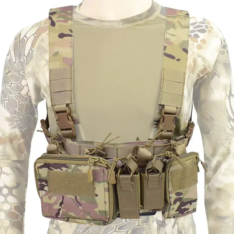 Multicam-patterned tactical chest rig with tan webbing and adjustable straps.