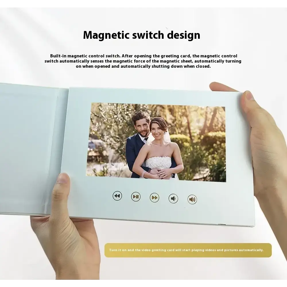 White electronic greeting card with a built-in screen displaying a couple’s photo, featuring magnetic switch controls for playback.