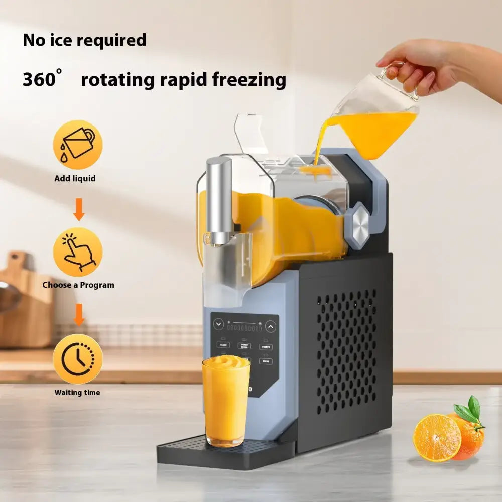 A sleek, modern countertop frozen drink maker with a black and silver body, transparent orange liquid reservoir, digital control panel, and a glass cup filled with freshly made smoothie.
