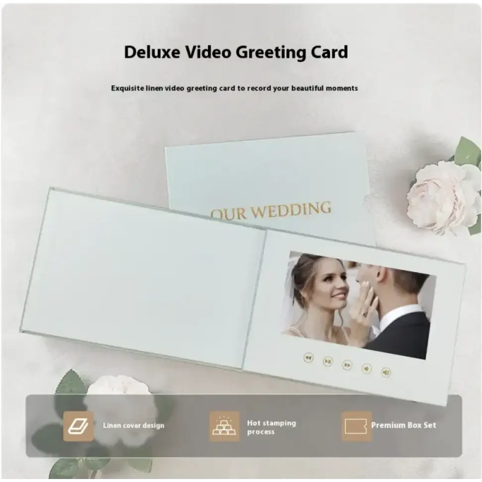 Deluxe video greeting card with a linen cover design, featuring an embedded screen displaying a wedding moment and gold-embossed ’our wedding’ text.