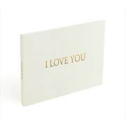 White ’i love you’ greeting book with gold foil lettering.
