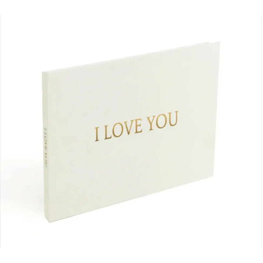 White ’i love you’ greeting book with gold foil lettering.