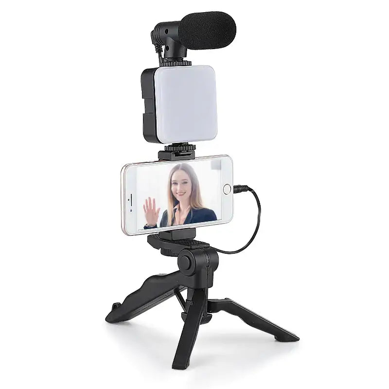 Black tripod-mounted phone video setup with led light and microphone