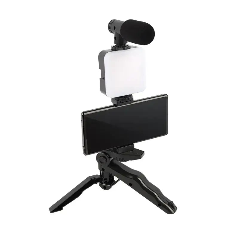 Black tripod-mounted smartphone video setup with integrated led light and microphone