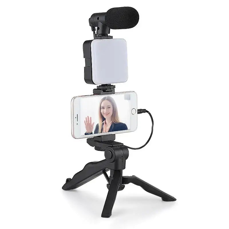 Black tripod-mounted smartphone streaming kit with attached led light and microphone
