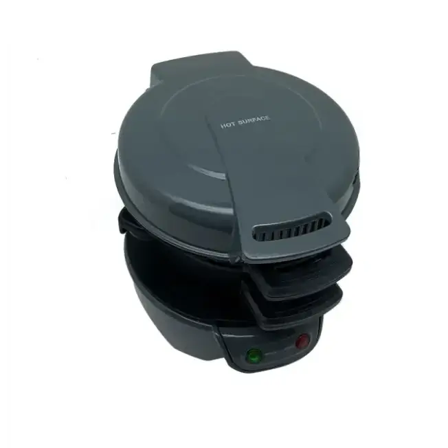 Dark gray electric pancake maker with a hinged lid and two indicator lights on the base.