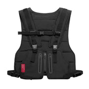 Black quilted tactical vest with adjustable straps and multiple zippered pockets.