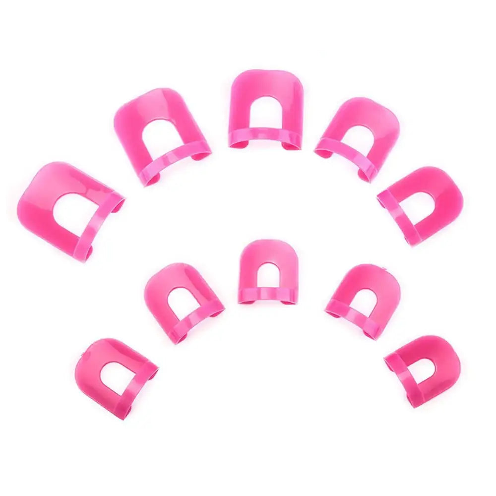 Bright pink plastic nail guards arranged in a circular pattern.