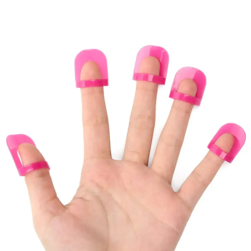 Pink plastic finger guards for nail care.