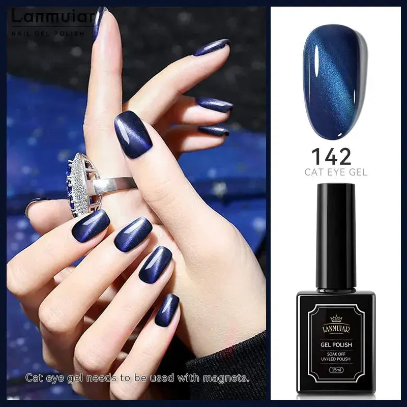 Deep blue cat eye gel polish in a sleek black bottle, featuring a glossy finish with shimmering metallic flecks that create an iridescent effect under light.