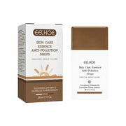 Eelhoe skin care essence anti-pollution drops in a sleek white and bronze bottle with matching box, featuring tocopherol (vitamin e) and calendula flower extract.