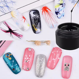Black gel nail polish in a black jar with a brush dipped into it.