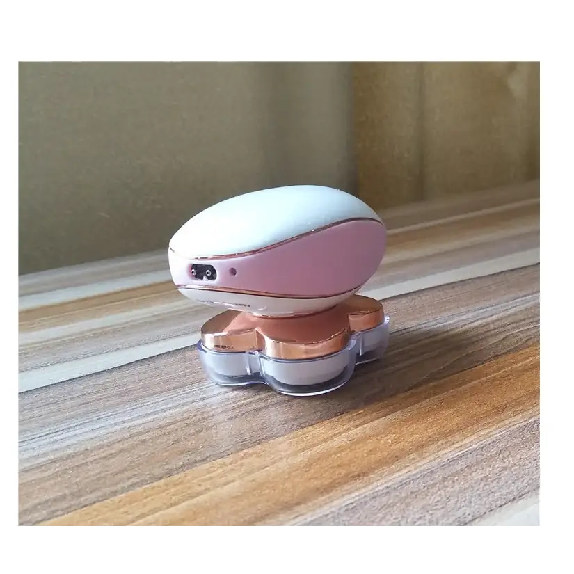 Pink and white electric razor with rose gold accents, featuring a sleek oval handle and four transparent blades.