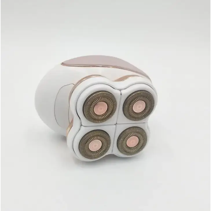 White and rose gold electric razor with four circular shaving heads.