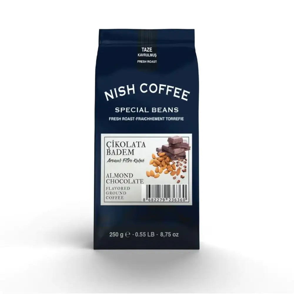 A dark blue bag of nish coffee’s almond chocolate flavored ground coffee, featuring a white label with images of almonds and chocolate pieces.
