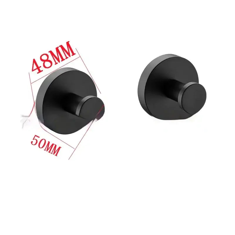 Black matte-finished wall-mounted hooks with a sleek, modern design.
