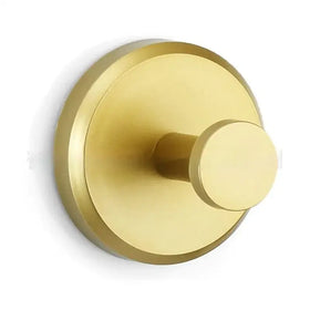 Brass-finished circular wall-mounted hook with a sleek, minimalist design.