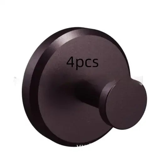 Black matte-finished wall-mounted robe hook, designed with a circular base and rounded peg.