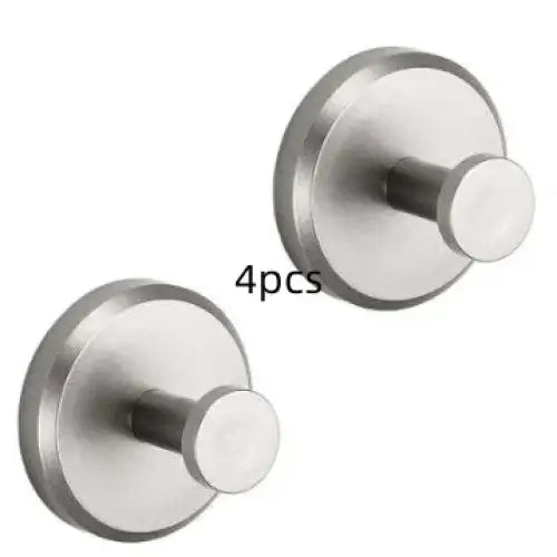 Stainless steel wall-mounted hooks, sleek and circular with a polished metallic finish.