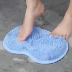 Light blue silicone foot scrubber with soft bristles.