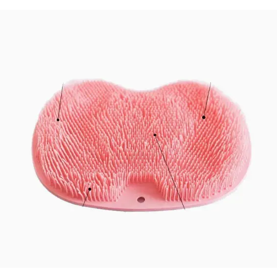 Pink silicone bath brush with soft, dense bristles arranged in a heart-shaped design.