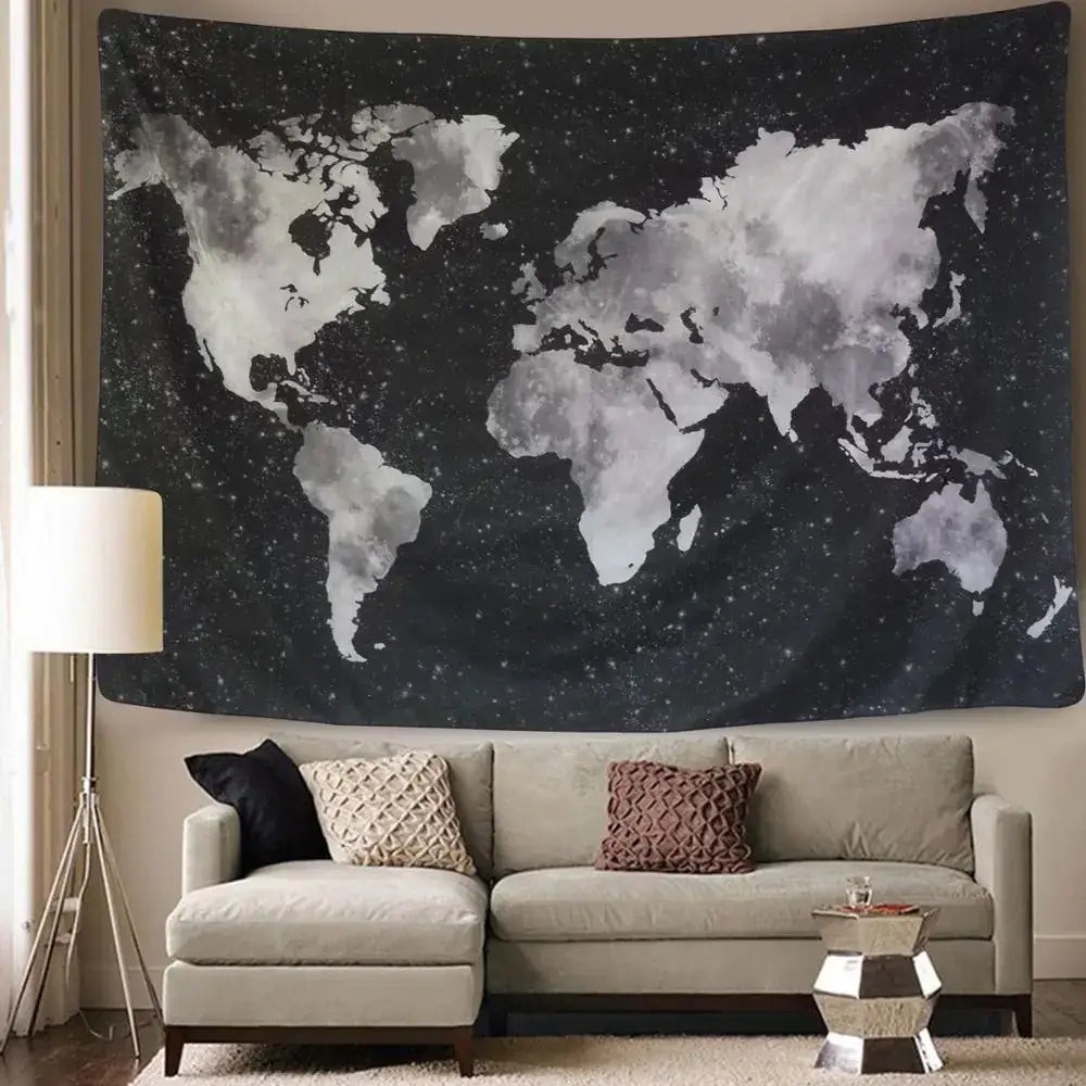 A black and gray watercolor-style world map tapestry hanging on the wall.