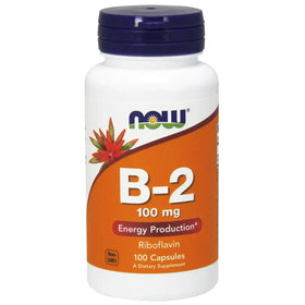 White plastic bottle with a dark blue cap and an orange label featuring the now brand logo, b-2 100 mg supplement information, and a red flower graphic.