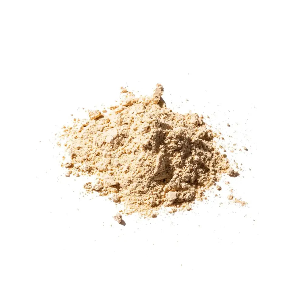 A mound of fine, light beige powder with a slightly granular texture.