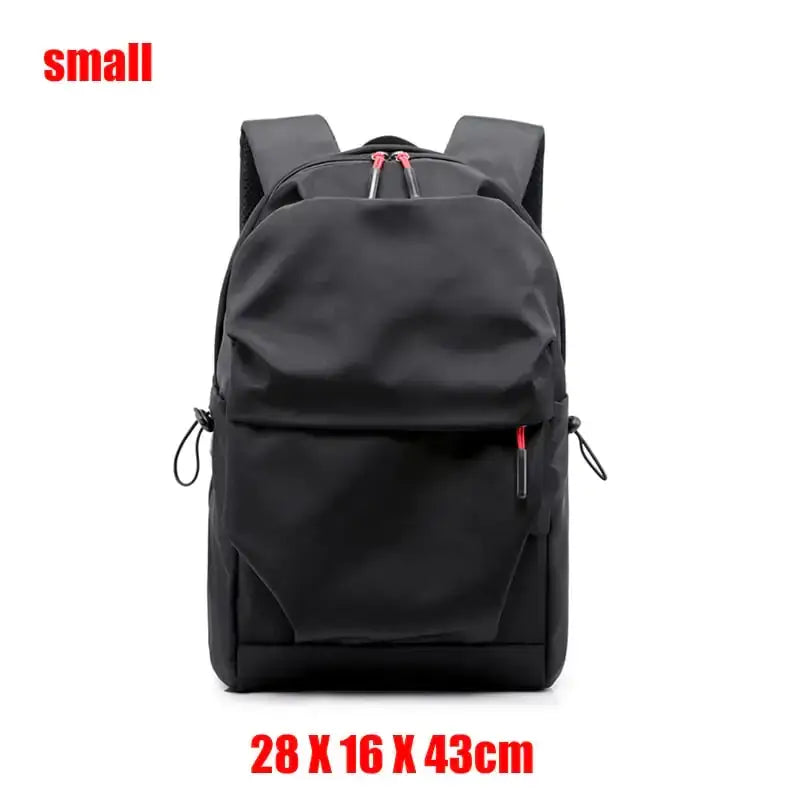 Black nylon backpack with red zipper pulls and black drawstrings.