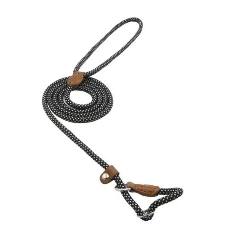 Black rope dog leash with white polka dots and brown leather accents.