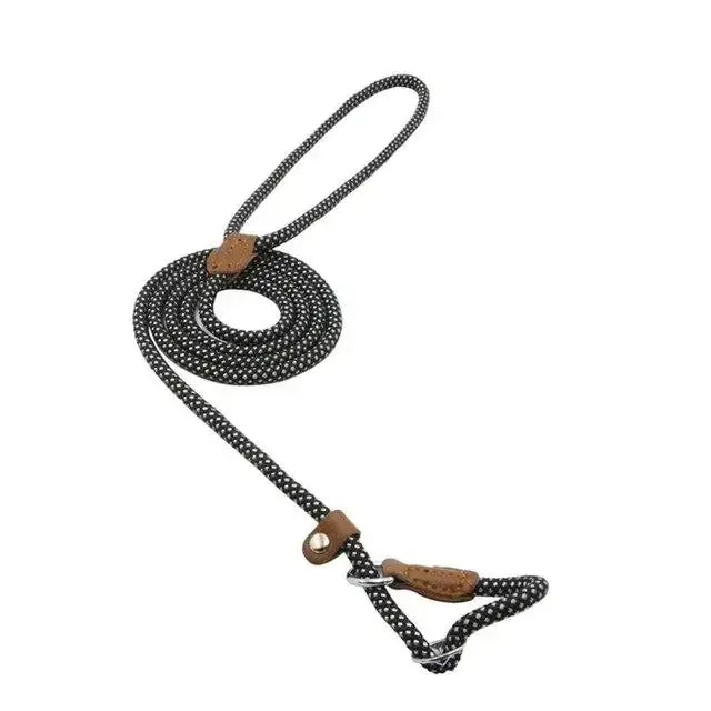 Black and white speckled rope dog leash with brown leather accents.