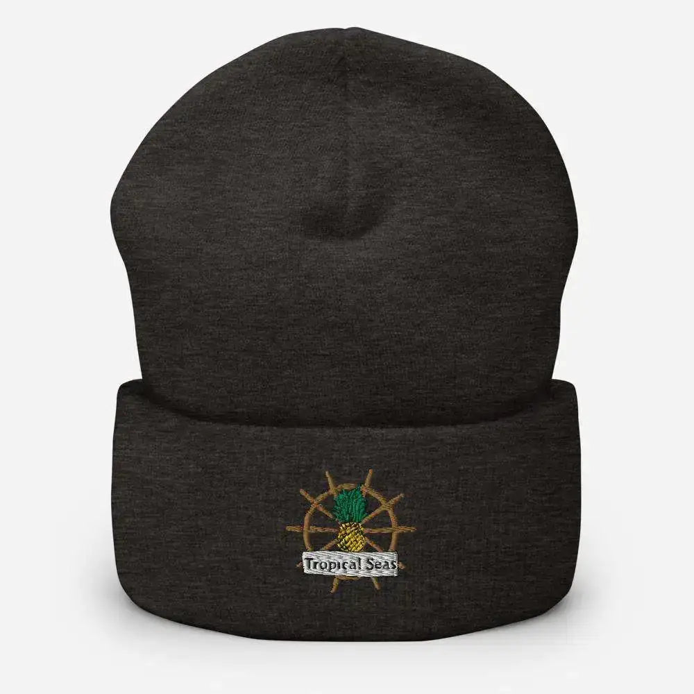 Dark heather gray cuffed knit beanie featuring an embroidered pineapple with a ship’s wheel and ’tropical seas’ banner.