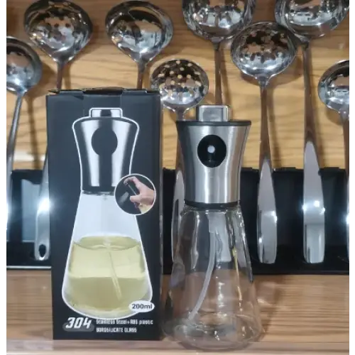 Stainless steel and clear glass 200ml oil dispenser with a sleek, modern design.